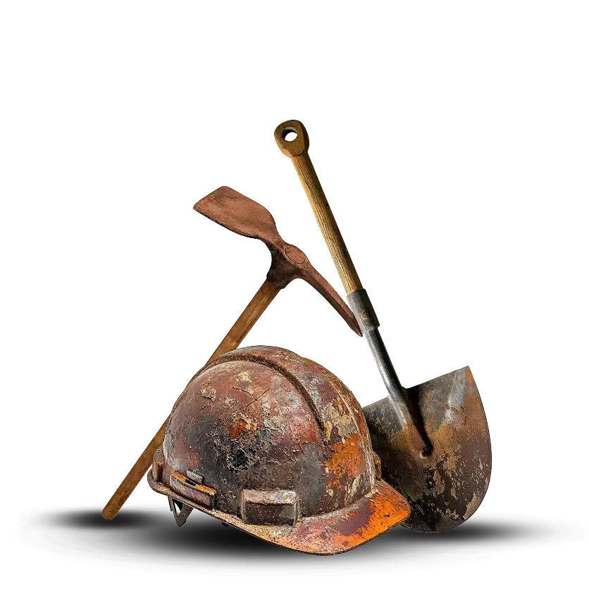 A rusty hard hat, pickaxe, and shovel are arranged together, showing signs of heavy use and wear, suggesting a mining or construction setting.