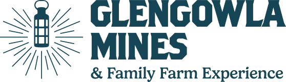 Logo for Glengowla Mines & Family Farm Experience, featuring a vintage lantern icon emitting rays next to the bold text "GLENGOWLA MINES & Family Farm Experience.